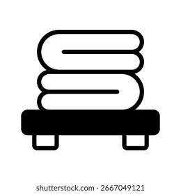 A neat glyph icon of folded clean clothes