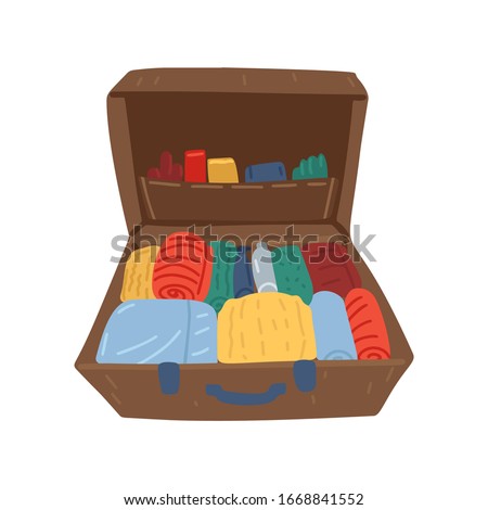 Neatly packed open suitcase. Full with clothes and accessories. Ready for vacation. Isolated on white background. Vector cartoon illustration 