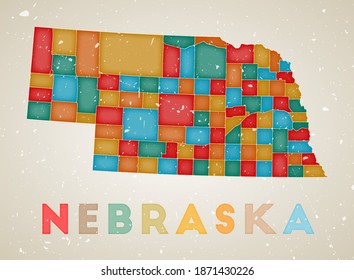 Nebraska map. US state poster with colored regions. Old grunge texture. Vector illustration of Nebraska with US state name.