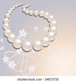 a necklace with beige pearl