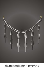Necklace under black pearls on a grey background.