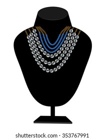 necklaces of pearls and blue stones hanged on a mannequin