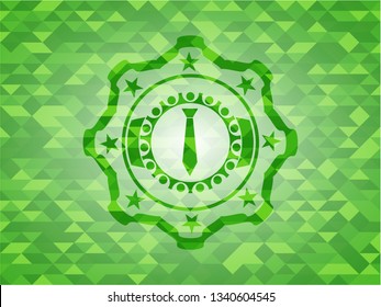 necktie icon inside green emblem with triangle mosaic background