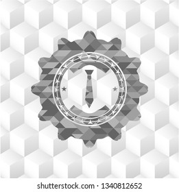 necktie icon inside grey emblem with geometric cube white background