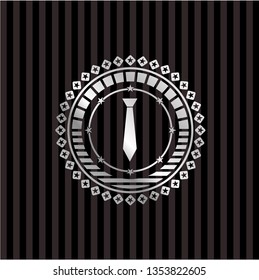 necktie icon inside silver emblem or badge