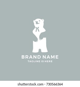 negative space cute teddy bear logo with ribbon tie logo template vector illustration
