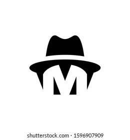 Negative space letter M wearing a hat
