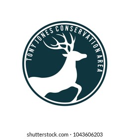 Negative space vector of running deer inside a circle. Abstract silhouette of a deer for stamps, tshirt, emblem, logo, etc