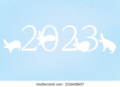 Nengajo for the Year of the Rabbit 2023, Japanese pattern background with the letters 2023, running and jumping rabbits and blue sea waves