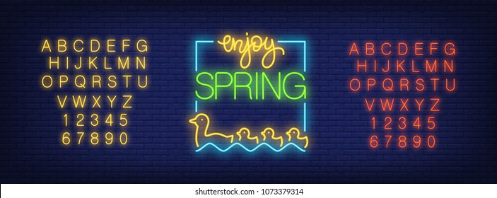 Neon alphabet and Enjoy Spring emblem with floating duck flock over brick background. Spring sale, seasonal goods, store emblem. Spring concept. For signboards, template design, banners