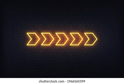 Neon arrow sign. Set of orange glowing neon arrow pointer on brick wall background