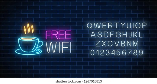 Neon cafe signboard with free wifi zone. Hot coffee cup and advertising lettering glowing sign with alphabet on a dark brick wall background. Vector illustration.