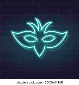 Neon carnival mask with feathers. Fututistic fluorescent silhouette on brick wall background. Square glowing icon for social network, poster, banner.