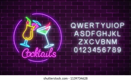 Neon cocktails bar sign with alphabet and two glasses of cocktails on dark brick wall background. Glowing gas advertising with glasses of alcohol shake. Night club invitation Vector illustration