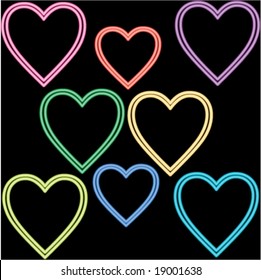 Neon colored glowing vector hearts on black