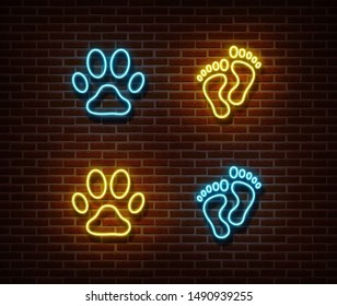 Neon footprint signs vector isolated on brick wall. Cat, dog, human foot print light symbol, decoration effect. Neon animal track illustration.