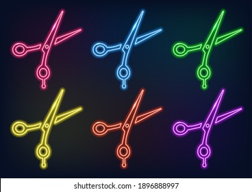 Neon frame. Set of neon scissors in different colors. Laser glowing lines on a black background.