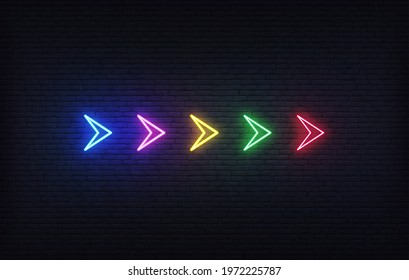 Neon futuristic arrow sign. Set of colorful glowing neon arrow pointer on brick wall background