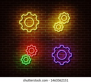 Neon gear signs vector isolated on brick wall. Neon mechanic light symbol. Vector illustration.