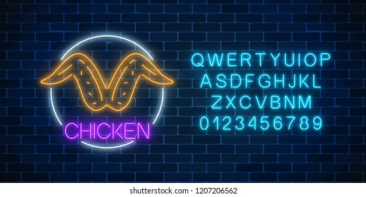Neon glowing sign of chicken wings in circle frame with alphabet on a dark brick wall background. Fastfood light billboard symbol. Cafe menu item. Vector illustration.