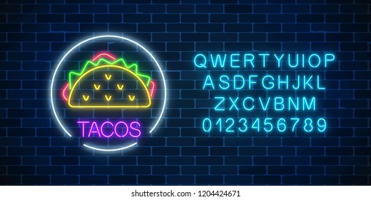 Neon glowing sign of tacos in circle frame wuth alphabet on a dark brick wall background. Fastfood light billboard symbol. Cafe menu item. Vector illustration.