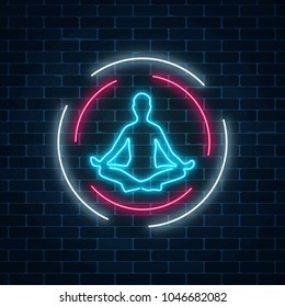 Neon glowing sign of yoga exercices club with lotus pose in circle frames on dark brick wall background. Street lights signboard of chinese gymnastics. Vector illustration.