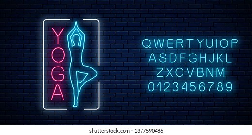 Neon glowing sign of yoga exercices in rectangle frame with alphabet on dark brick wall background. Street advertising signboard of chinese gymnastics club. Vector illustration.