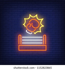 Neon icon of boxing round. Protective glove and boxing ring on brick wall background. Sport or fight club concept. Can be used for neon signs, posters, billboards, banners.