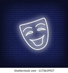 Neon icon of comic mask on brick wall background. Performance concept. Vector illustration can be used for neon signs, advertising, billboards, comedy show