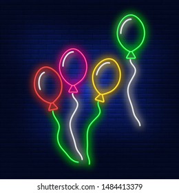 Neon illumination of balloons. The bright advertisement of the holiday. Modern vector logo, banner, shield, balls pattern. Night advertising on the background of a brick wall.