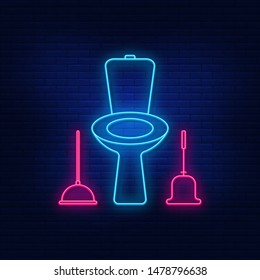 Neon illumination of the toilet. Bright is the toilet, the toilet brush, plunger. Night advertising on the background of a brick wall.