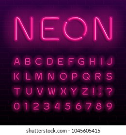 Neon lamp alphabet font. Neon color shiny letters, numbers and symbols. Brick wall background. Stock vector typeface for any typography design.