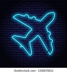 Neon lamp contour shaped passenger aircraft, top view. With blue glow on the brick wall background. Illuminated advertising sign for your design.