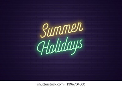 Neon lettering of Summer Holidays. Glowing headline, bright neon cursive text of Summer Holidays. Title template for web banner and poster. Yellow and green color