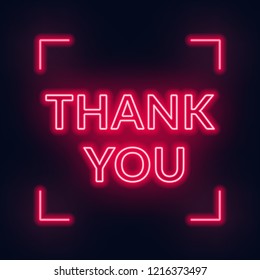 Neon lettering thank you on a dark background.