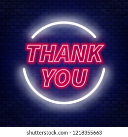 Neon lettering thank you on a dark background.