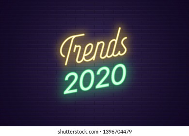 Neon Lettering Of Trends 2020. Glowing Headline, Bright Neon Cursive Text Of Trends 2020. Title Template For Web Banner And Poster. Yellow And Green Color