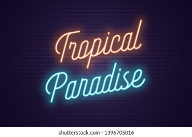 Neon lettering of Tropical Paradise. Glowing headline, bright neon cursive text of Tropical Paradise. Title template for web banner and poster. Orange and blue color