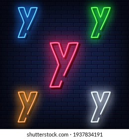 Neon letters, five colors: red, blue, green, yellow, white. Isolated font on a blue brick wall background. Vector illustration eps 10.