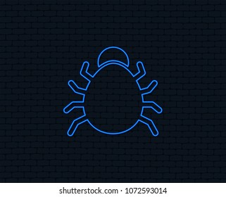 Neon light. Bug sign icon. Virus symbol. Software bug error. Disinfection. Glowing graphic design. Brick wall. Vector