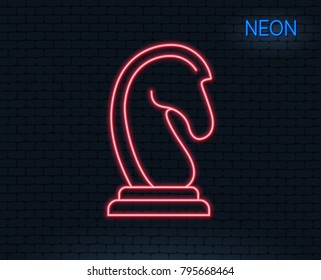 Neon light. Chess Knight line icon. Marketing strategy symbol. Business targeting sign. Glowing graphic design. Brick wall. Vector