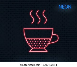 Neon light. Doppio coffee icon. Hot drink sign. Beverage symbol. Glowing graphic design. Brick wall. Vector
