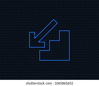 Neon light. Downstairs icon. Down arrow sign. Glowing graphic design. Brick wall. Vector