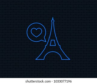 Neon light. Eiffel tower icon. Paris symbol. Speech bubble with heart sign. Glowing graphic design. Brick wall. Vector
