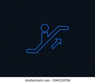 Neon light. Escalator staircase icon. Elevator moving stairs up symbol. Glowing graphic design. Brick wall. Vector