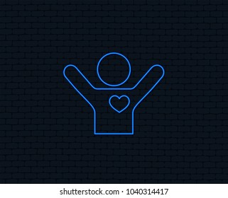 Neon light. Fans love icon. Man raised hands up sign. Glowing graphic design. Brick wall. Vector