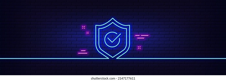 Neon light glow effect. Approved shield line icon. Accepted or confirmed sign. Protection symbol. 3d line neon glow icon. Brick wall banner. Approved shield outline. Vector