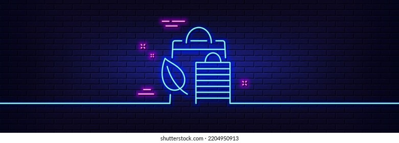 Neon light glow effect. Bio shopping bags line icon. Leaf sign. Natural products symbol. 3d line neon glow icon. Brick wall banner. Bio shopping outline. Vector