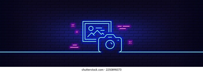 Neon light glow effect. Photo camera line icon. Image photography sign. Picture placeholder symbol. 3d line neon glow icon. Brick wall banner. Photo camera outline. Vector