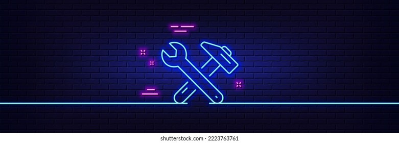 Neon light glow effect. Spanner and hammer line icon. Repair service sign. Fix instruments symbol. 3d line neon glow icon. Brick wall banner. Spanner tool outline. Vector